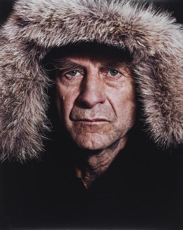 Sir Ranulph Fiennes, born in 1944, is a British explorer known for his extraordinary feats of endurance and exploration across some of the world's most challenging environments. Fiennes has led numerous expeditions to remote and inhospitable regions, including the Arctic and Antarctic, as well as mountainous terrains such as the Himalayas and the Andes. In 1979, he made history by completing the first surface circumnavigation of the world along the polar axis, known as the Transglobe Expedition.